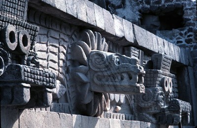 Quetzalcoatl Pyramid detail, stone sculpture of plumed serpent head.